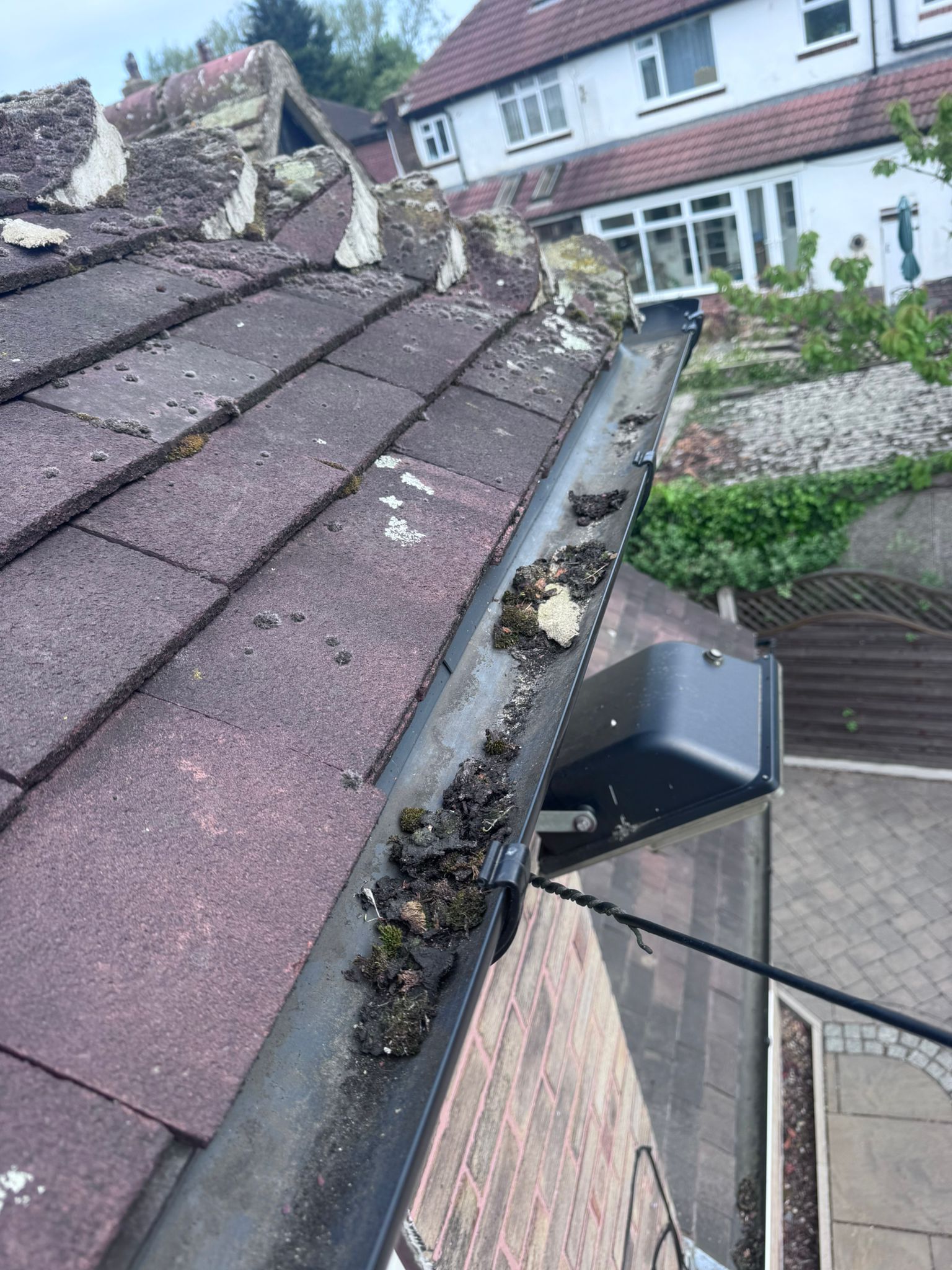 Blocked gutter in Oldham area property